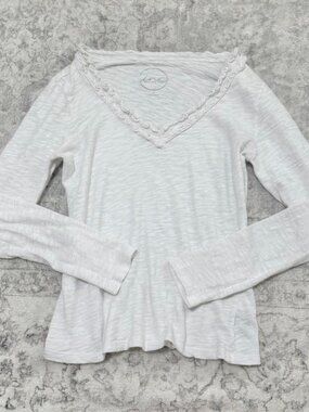 dainty white long sleeve off the shoulder top v neck w ruffled trim